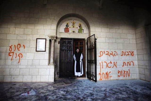 “Jesus is a monkey” once again spray painted on the wall.  The door to the monastery was set ablaze. 