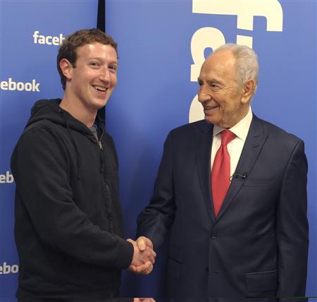 Handout photo of Israeli president Shimon Peres with Facebook CEO Mark Zuckerberg